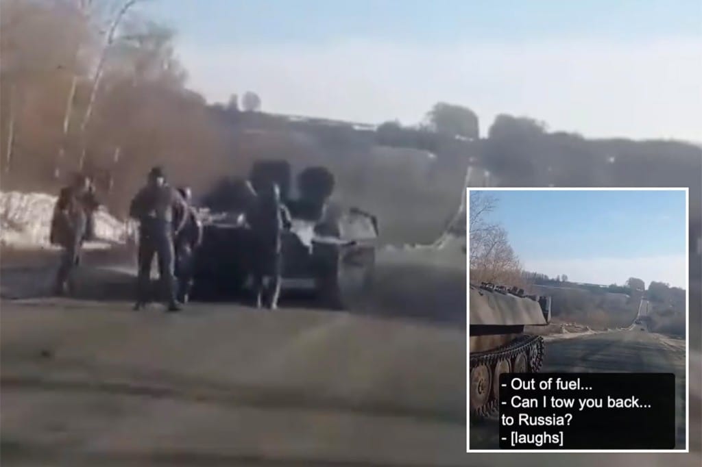 Russian soldiers stuck on the road charred by a Ukrainian driver
