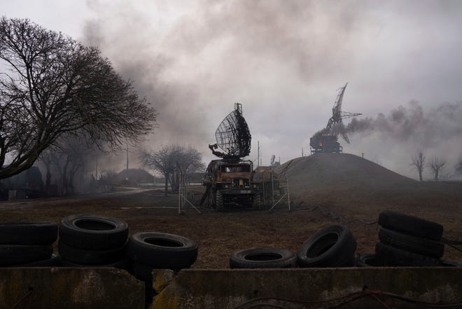Smoke rises from an air defense base following an apparent Russian raid in Mariupol, Ukraine, Thursday, February 24, 2022. Russian forces launch their expected attack on Ukraine.