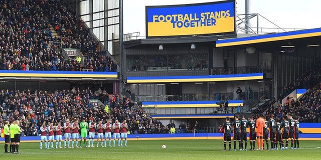 Players support Ukraine before kick-off during the Premier League match between Burnley and Chelsea at Turf Moor on March 5, 2022 in Burnley, United Kingdom.